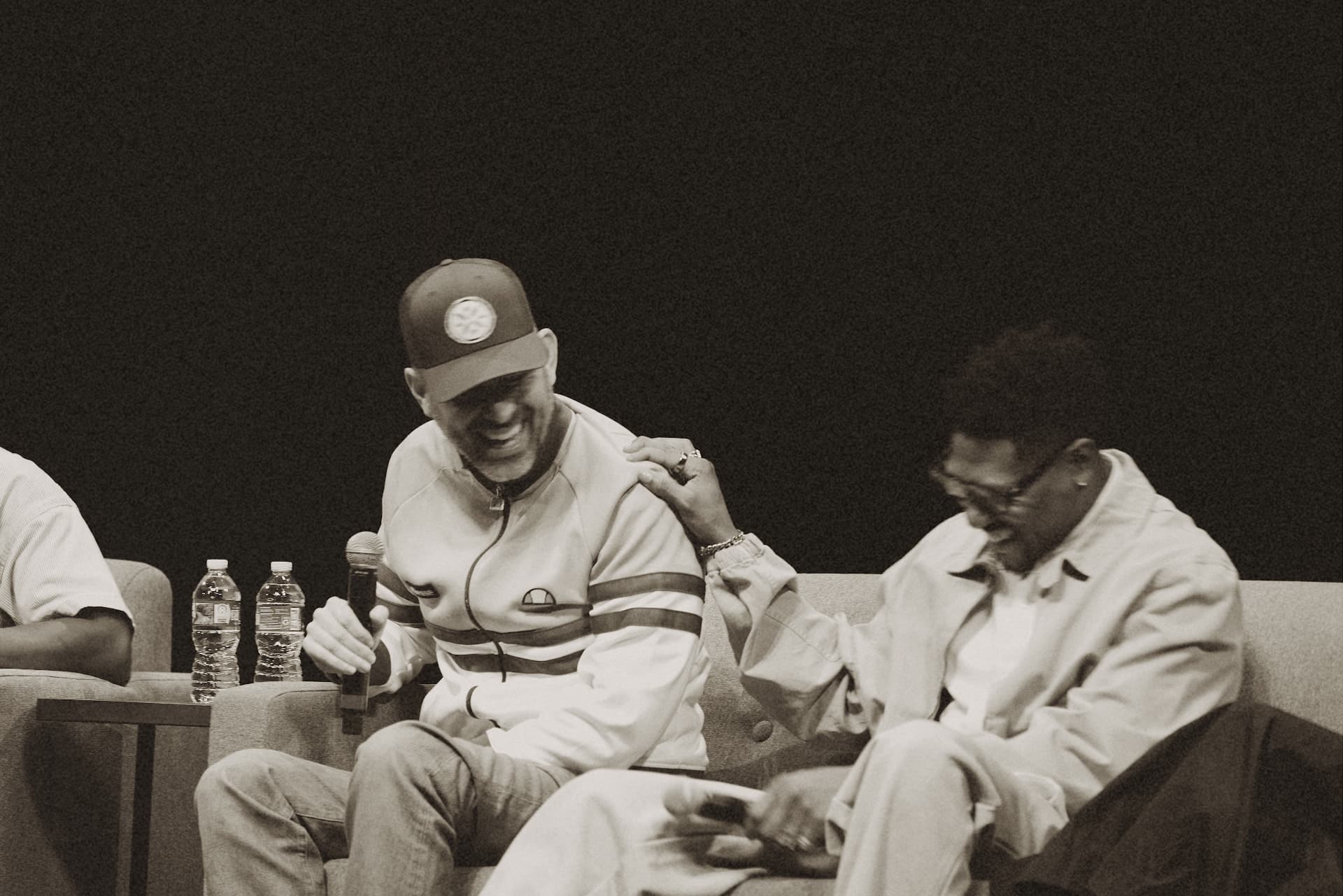 Panelists sharing a laugh during a ViewerCon session